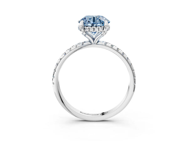 White gold Fancy Blue Round Cut Diamond Solitaire Ring with Four-Prong Setting and Pavé Band