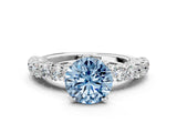White gold Fancy Blue Round Cut Diamond Solitaire Ring with Shared Prong Pavé Band and Four-Prong Setting_58