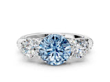White gold Fancy Blue Round Cut Diamond Three-Stone Ring with Prong Setting and Pavé Band