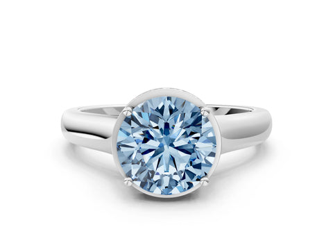 White gold Fancy Blue Round Cut Solitaire Diamond Engagement Ring with Four-Prong Setting and Tapered Band