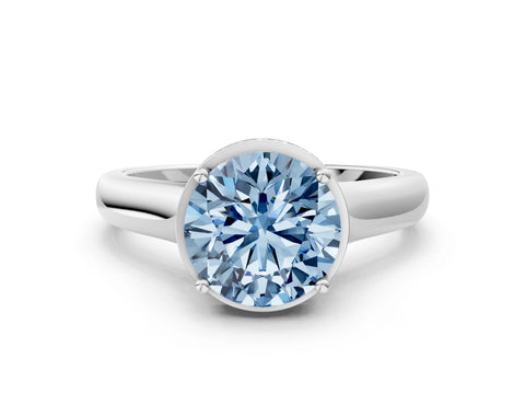 White gold Fancy Blue Round Cut Solitaire Diamond Engagement Ring with Four-Prong Setting and Tapered Band
