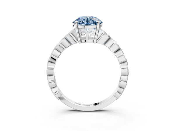 White gold Fancy Blue Round Cut Solitaire Diamond Ring with Infinity Twist Band and Four-Prong Setting