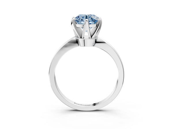White gold Fancy Blue Round Cut Solitaire Engagement Ring with Six-Prong Setting and Tapered Band