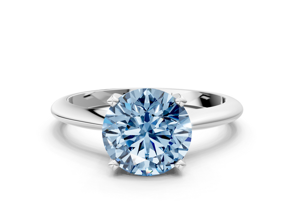 White gold Fancy Blue Round  Cut Solitaire Ring with Four-Prong Setting on a Classic Band