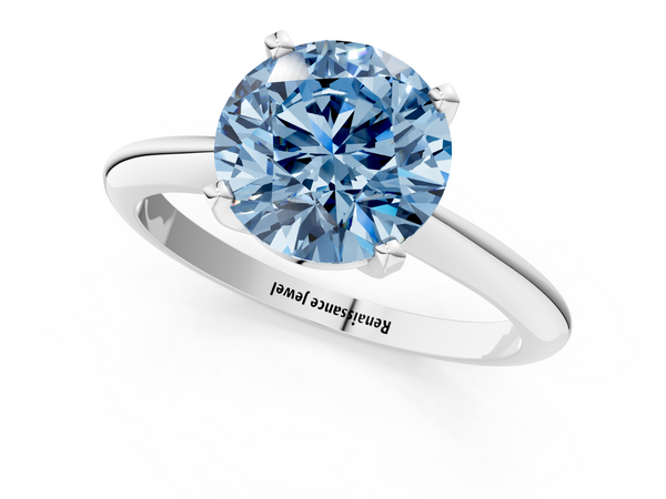 White gold Fancy Blue Round  Cut Solitaire Ring with Four-Prong Setting on a Classic Band