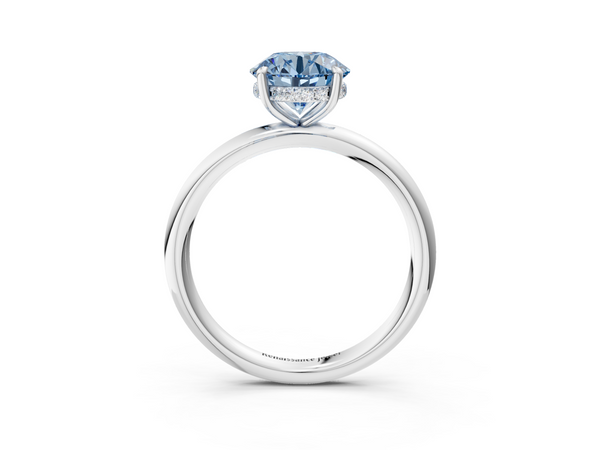 White gold Fancy Blue Round Cut Diamond Solitaire Ring with Thin Band and Four-Prong Setting