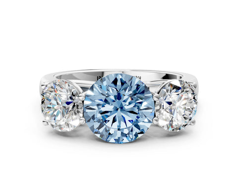 White gold Fancy Blue Round Cut Three-Stone Diamond Ring with Prong Setting on a Classic Band