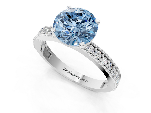 White gold Fancy Blue Round Cut Diamond Milgrain Pavé Engagement Ring with Four-Prong Setting