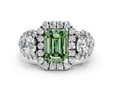 White gold Fancy Green Emerald Cut Diamond Three-Stone Halo Ring with Prong Setting and Pavé Accents