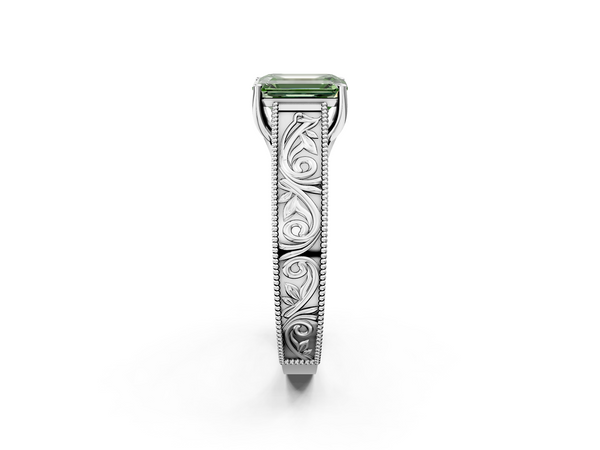 White gold Fancy Green Emerald Cut Diamond Solitaire Ring with Engraved Band and Four-Prong Setting