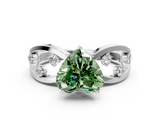 White gold Fancy Green Heart  Cut Solitaire Diamond with Side Stones on Criss-Cross Band and Four-Prong Setting