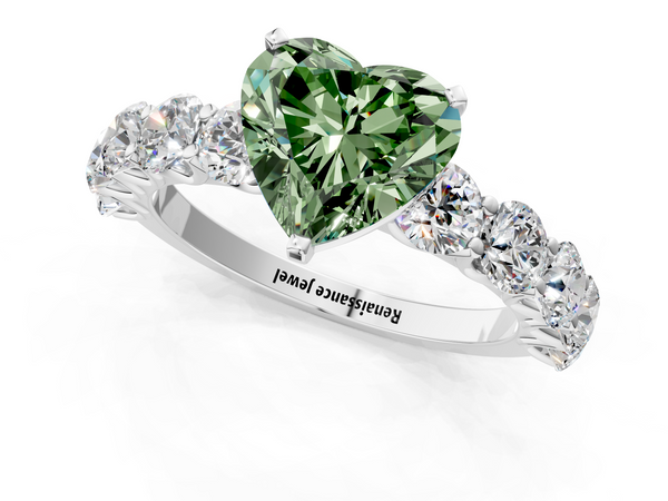White gold Fancy Green Heart Cut Diamond Prong Setting with Side Stones on a Pave Band