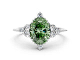 White gold Fancy Green Oval Cut Brilliant Diamond with Cluster Setting on a Beaded Band and Four-Prong Setting