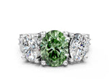 White gold Fancy Green Oval Cut Diamond Three-Stone Ring with Channel Set Band and Four-Prong Setting_61