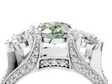 White gold Fancy Green Oval Cut Diamond Three-Stone Ring with Channel Set Band and Four-Prong Setting_65
