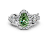 White gold Fancy Green Pear Cut Halo Diamond Ring with Milgrain and Bezel Accents on a Split Shank Band