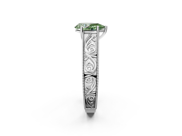 White gold Fancy Green Pear Cut Diamond Solitaire Ring with Engraved Band and Four-Prong Setting