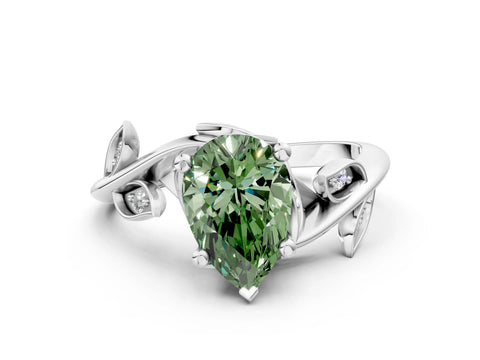 White gold Fancy Green Pear Cut Solitaire Twist Engagement Ring with Leaf Accents and Prong Setting