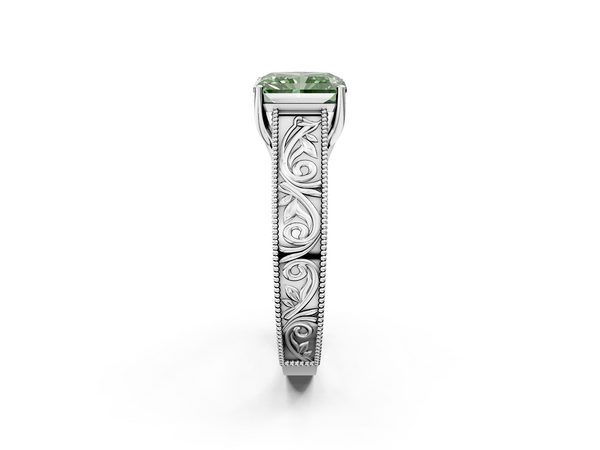 White gold Fancy Green Radiant Cut Diamond Solitaire Ring with Engraved Band and Four-Prong Setting
