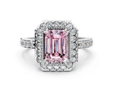 White gold Fancy Pink Emerald Cut Diamond Halo Ring with Pavé Band and Prong Setting