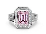 White gold Fancy Pink Emerald Cut Diamond Halo Ring with Split Shank and Bezel Accents and Prong Setting