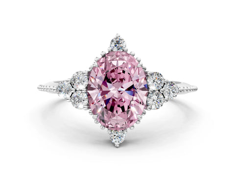 White gold Fancy Pink Oval Cut Brilliant Diamond with Cluster Setting on a Beaded Band and Four-Prong Setting