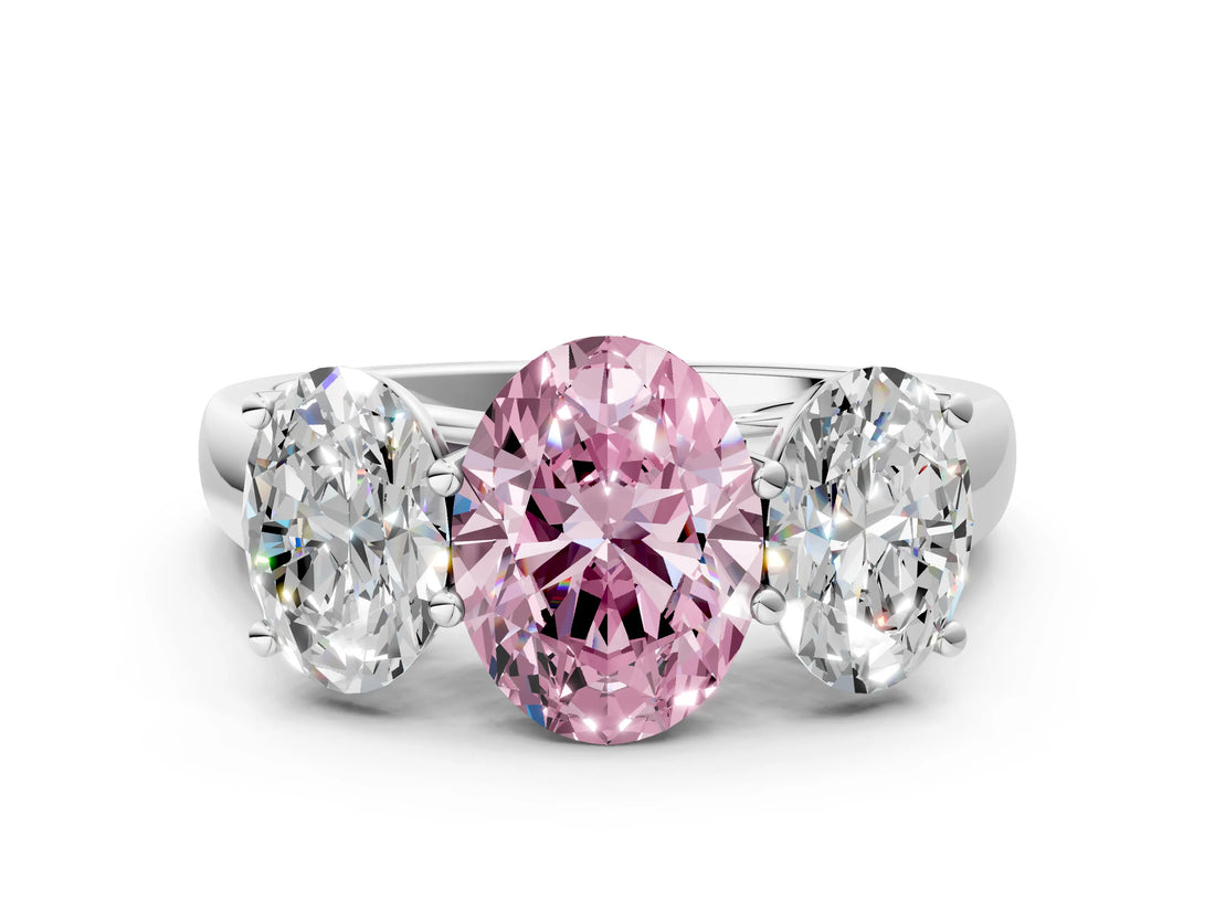 White gold Fancy Pink Oval Cut Three-Stone Diamond Ring with Prong Setting on a Classic Band