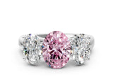 White gold Fancy Pink Oval Cut Three-Stone Diamond Ring with Prong Setting on a Classic Band