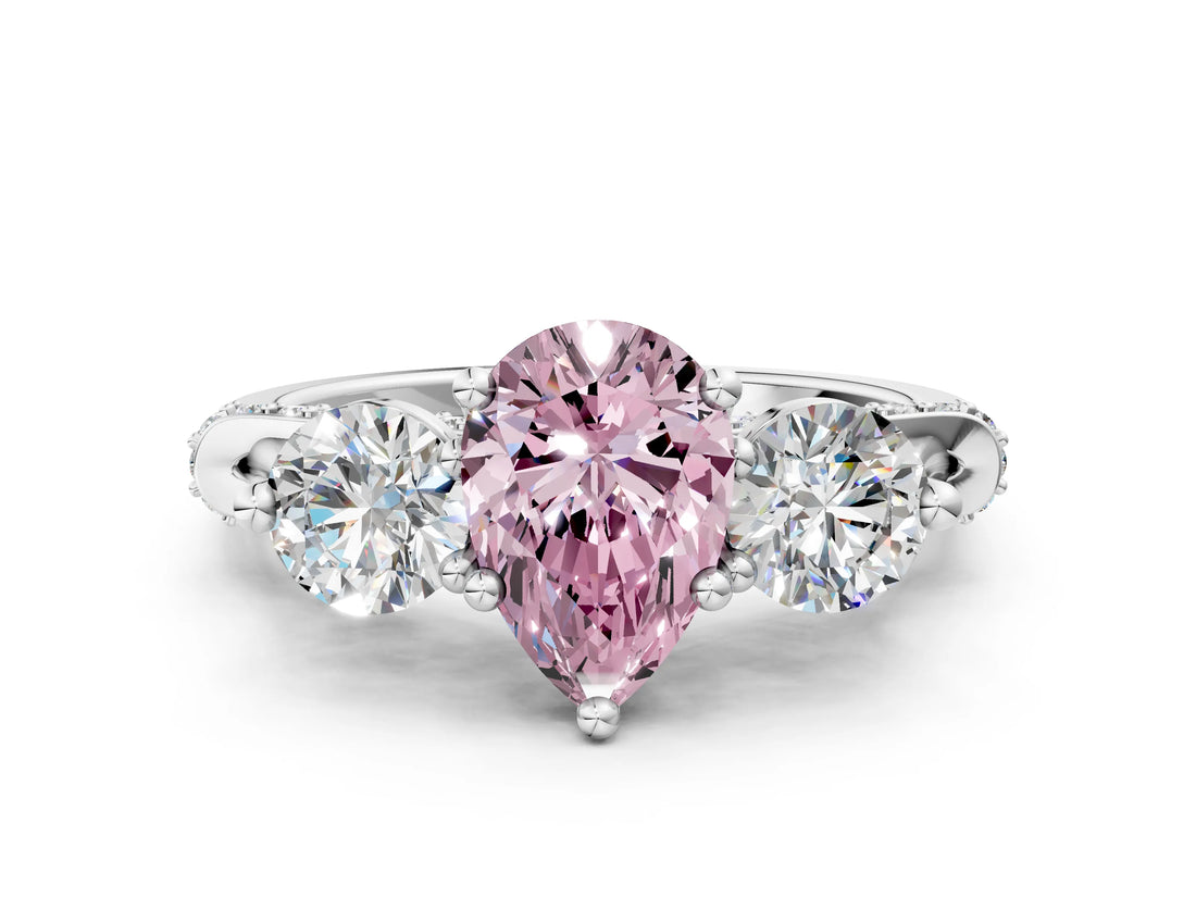 White gold Fancy Pink Pear Cut Diamond Three-Stone Ring with Prong Setting and Pavé Band