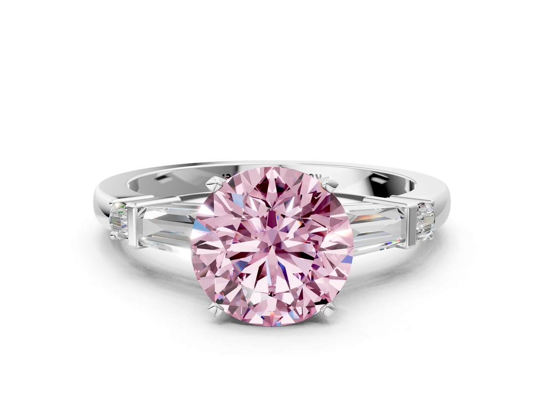 White gold Fancy Pink Round  Cut Diamond Ring with Baguette Side Stones, Channel Set Band, and Four-Prong Setting