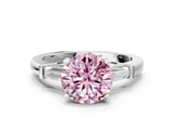 White gold Fancy Pink Round  Cut Diamond Solitaire Ring with Tapered Baguette Accents and Four-Prong Setting