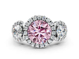 White gold Fancy Pink Round Cut Diamond Three-Stone Halo Ring with Prong Setting and Pavé Accents