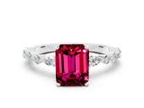 White gold Fancy White Emerald Cut Garnet Solitaire with Side Stones on a Pavé Band and Four-Prong Setting