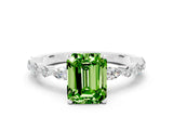 White gold Fancy White Emerald Cut Peridot Solitaire with Side Stones on a Pavé Band and Four-Prong Setting
