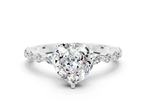 White gold Fancy White Heart Cut Moissanite Solitaire with Side Stones on a Pavé Band and Four-Prong Setting