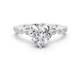 White gold Fancy White Heart Cut Moissanite Solitaire with Side Stones on a Pavé Band and Four-Prong Setting