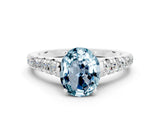 White gold Fancy White Oval Cut Aquamarine Solitaire Ring with Cathedral Setting and Pavé Band