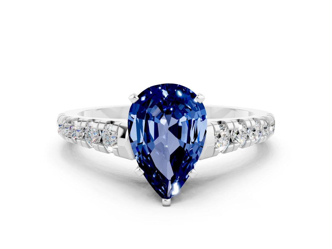 White gold Fancy White Pear Cut Blue Sapphire Solitaire Ring with Cathedral Setting and Pavé Band