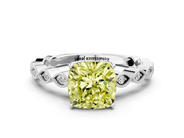 White gold Fancy Yellow Cushion Cut Solitaire Diamond Ring with Infinity Twist Band and Four-Prong Setting