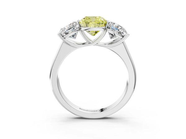 Platinum Fancy Yellow Cushion Cut Three-Stone Diamond Ring with Prong Setting on a Classic Band