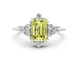 White gold Fancy Yellow Emerald Cut Brilliant Diamond with Cluster Setting on a Beaded Band and Four-Prong Setting_18