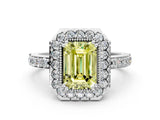White gold Fancy Yellow Emerald Cut Diamond Halo Ring with Pavé Band and Prong Setting