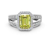 White gold Fancy Yellow Emerald Cut Diamond Halo Ring with Split Shank Pavé Band and Four-Prong Setting