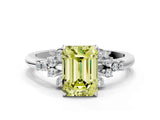 White gold Fancy Yellow Emerald Cut Diamond Ring with Side Stones and Four-Prong Setting_117