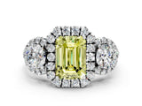 White gold Fancy Yellow Emerald Cut Diamond Three-Stone Halo Ring with Prong Setting and Pavé Accents
