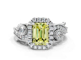 White gold Fancy Yellow Emerald Cut Halo Diamond Ring with Milgrain and Bezel Accents on a Split Shank Band
