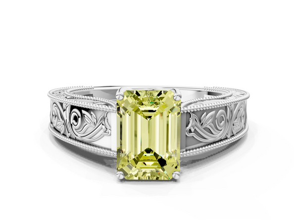 White gold Fancy Yellow Emerald Cut Diamond Solitaire Ring with Engraved Band and Four-Prong Setting