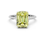 White gold Fancy Yellow Emerald Cut Solitaire Split Shank Pave Diamond Engagement Ring with Four-Prong Setting