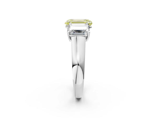 White gold Fancy Yellow Emerald Cut Three-Stone Diamond Ring with Prong Setting on a Classic Band