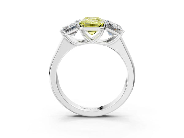 White gold Fancy Yellow Emerald Cut Three-Stone Diamond Ring with Prong Setting on a Classic Band